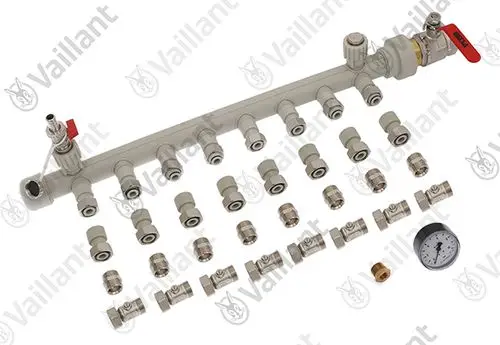 Vaillant Verteilerrohr mit mehreren Anschlussmöglichkeiten und einem Manometer, konzipiert für Wärmesysteme, angeordnet auf einem weißen Untergrund.